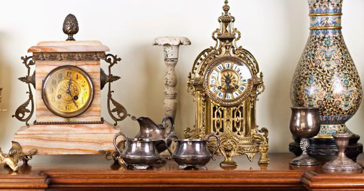 collection of antique items on a sideboard